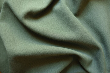 Sticker - Folded reseda green polyester fabric with herringbone pattern