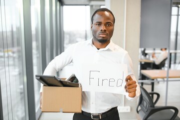 Portrait of african american employee being fired.