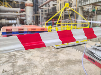 Tap red white color warning barrier safety hazard caution stop line sign in industrial factory area