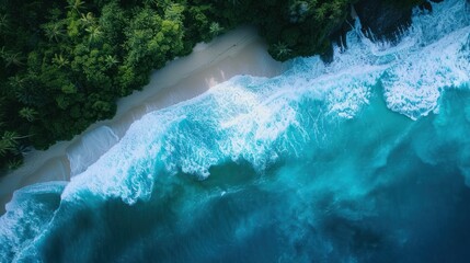 Wall Mural - Aerial view of blue ocean waves along the beautiful natural beach of the Andaman Sea. Southern Thailand