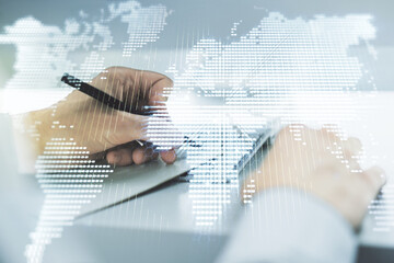 Wall Mural - multi exposure of abstract creative digital world map and hand writing in notebook on background wit