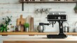 © lililia - A black espresso machine sits on a wooden kitchen countertop, ready to make a fresh cup of coffee.