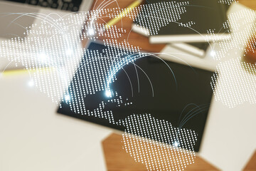 Wall Mural - double exposure of abstract digital world map with connections and digital tablet on background, top