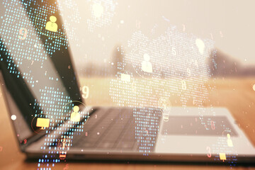 Wall Mural - double exposure of social network icons concept with world map and computer on background. networkin