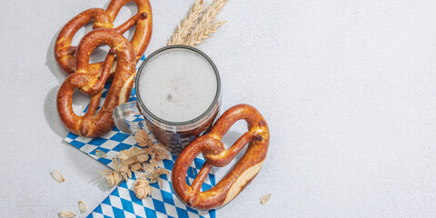 Wall Mural - Traditional Oktoberfest set. Pretzels and beer, German festival food concept. Trendy hard light