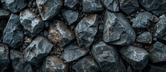 Aufkleber - Background of black textured rocks with ample copy space image.