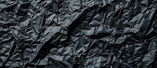 Poster - Black crumpled paper with copy space image.