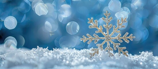 Blue snowy background with a Christmas snowflake, creating a picturesque scene with copy space image.