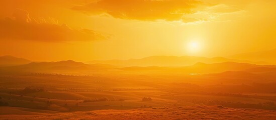 Wall Mural - Capture the stunning sunset with a fiery orange sky, offering a picturesque view with plenty of empty space for text or images. image with copy space