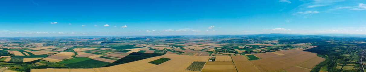 Wall Mural - Aerial view of a countryside with cultivated fields. Panoramic view of a rural area with different agricultural crops