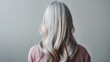 © Gasspoll - Back view of woman with long silver hair in soft light