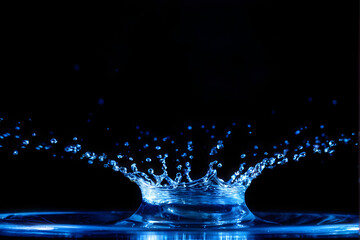 Wall Mural - water splash isolated on the black background