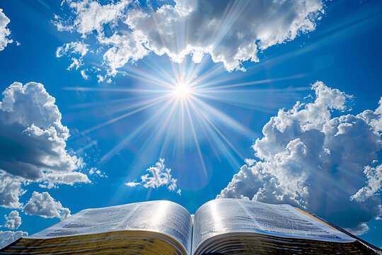 a book with the sun shining through the clouds