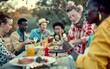 © Ryzhkov - Diverse Group of Friends Enjoying a Vibrant Outdoor Meal at Campsite, Showcasing Cultural Diversity and Friendship