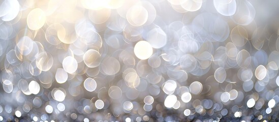 Wall Mural - Abstract white and silver bokeh lights in soft focus, perfect as a background with copy space image.