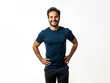 © Favio - 20s Latino man, he is standing with his hands on his hips wearing a blue t-shirt, positive and smiling, isolated on a white background.