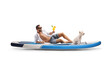 © Ljupco Smokovski - Young man with a dog sitting on a SUP and holding a cocktail