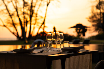 Canvas Print - Sunset at the beach bar in Mai Khao Beach Resort in Phuket Thailand