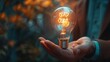© Lucy - Innovative businessman holding glowing light bulb representing creative thinking, new ideas, and inspiration. Bright flash symbolizes energy and innovation on a blurred background with copy space bann