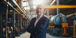 © Mr. Stocker - Confident factory manager standing in industrial setting