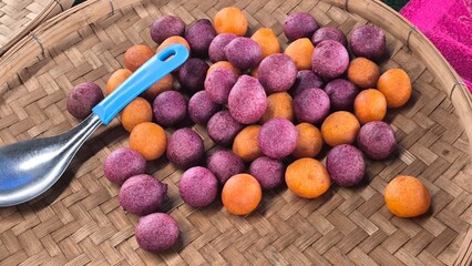 Orange and purple round fried dough snacks