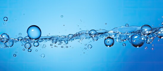 Aufkleber - A vivid blue backdrop with splashing bubbles enhancing the copy space image.