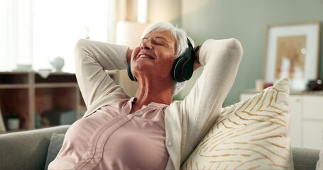 Wall Mural - Senior, woman and relax on couch with headphones for streaming song, nostalgic hits and classic audio from past. Elderly person, home and calm on sofa with comfort, melody and listening with peace.