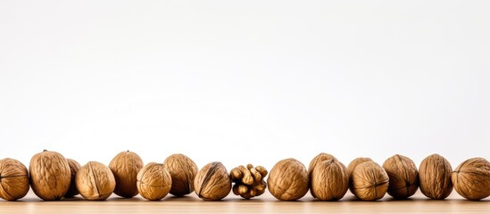 Aufkleber - Angle view of walnuts placed on a table with a white background, creating a captivating composition with copy space image.
