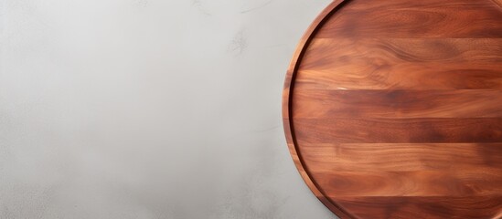 Poster - Circular wooden pizza platter on a white stone kitchen table, seen from above with space for text or images in the middle. with copy space image. Place for adding text or design