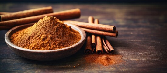Poster - Ceylon cinnamon sticks and powder on a textured wooden surface, perfect for baking, desserts, and drinks, with a fragrant aroma. Close-up with copy space image.