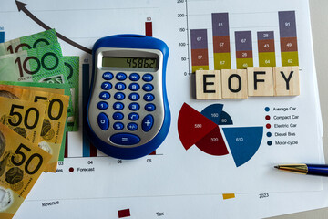 Poster - Statistic finance document pen calculator aud Australia dollar banknotes and EOFY on wooden cubes