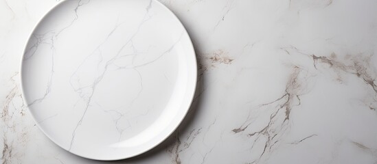 Wall Mural - A blank white plate on a white stone tabletop seen from above, with ample space for additional imagery.