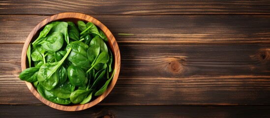 Aufkleber - Healthy food: Delicious cooked spinach on a rustic wooden surface with a flat lay perspective, providing ample space for adding text within the image.