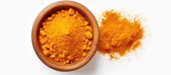 Poster - Top view of turmeric powder in a wooden bowl and turmeric root isolated on a white background with copy space image, laid flat.