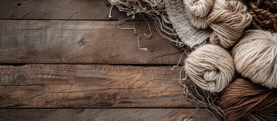 Rustic wooden table showcasing various types of wool with copy space image.