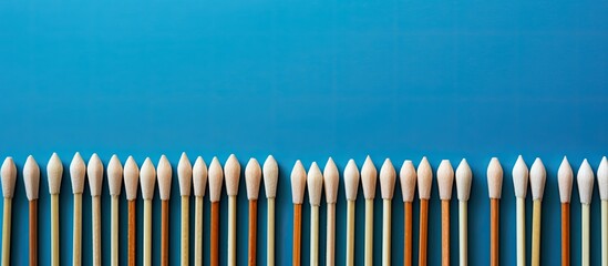 Poster - Close-up view of various new matchsticks on a blue background with copy space image.