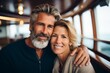 © NikoG - Portrait of a smiling mature couple on boat cruise
