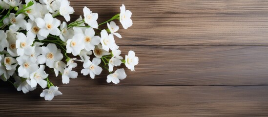 Aufkleber - Wooden surface with white flowers arranged for use as a background in a copy space image.