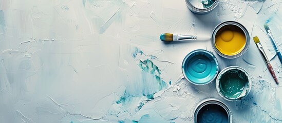 Canvas Print - Cans of paints and tools on light background. with copy space image. Place for adding text or design