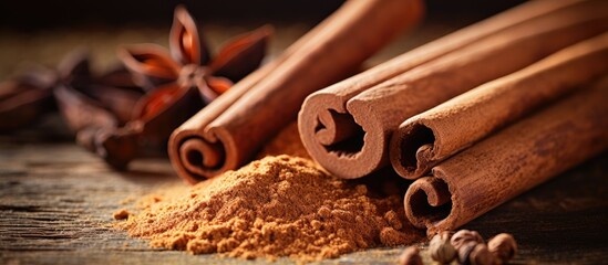 Poster - Close-up shot of Ceylon cinnamon sticks on textured wooden background with cinnamon roll, powder, ideal spice for baking, desserts, and drinks. Includes fragrant ground cinnamon with place for text,