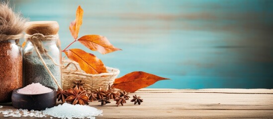 Leinwandbilder - Autumn spa still life setting with plant, bath salt on wood backdrop. Features assorted essential oil and sea salt with copy space image, promoting fall wellness and aromatherapy theme.