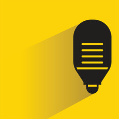 Wall Mural - light bulb icon with drop shadow on yellow background