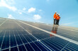 © ultramansk - engineer man inspects construction of solar cell panel or photovoltaic cell by electronic device. Industrial Renewable energy of green power. factory worker working on tower roof.