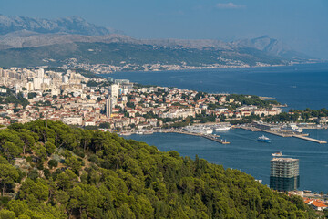 Wall Mural - Drone view of the coastal city Split in Croatia with sea view and greenery-covered cliffs