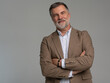© opolja - Entrepreneur in jacket smiling, Happy mid adult, mature age man standing, smiling