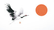 © elinacious - Ink painting of a red-head japanese crane and big red sun. Traditional oriental ink painting sumi-e, u-sin, go-hua. Hieroglyph - wind