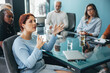 © Jacob Lund - Business woman discussing her ideas during a team meeting in a corporate boardroom