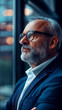 © Shubby Studio - A man in a suit and glasses is looking out the window
