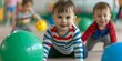 © Anastasiia - Young toddlers engaged in sports activities for physical fitness playing with balls. Concept Sports activities, Toddlers, Physical fitness, Balls, Active lifestyles