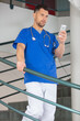 © auremar - male doctor discussing on mobile phone while walking downstairs
